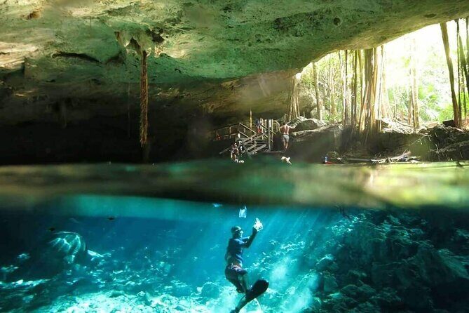 Discovering Breathtaking Cenotes in Tulum - Cenote Dos Ojos: two sinkholes, clear visibility, and great snorkeling conditions