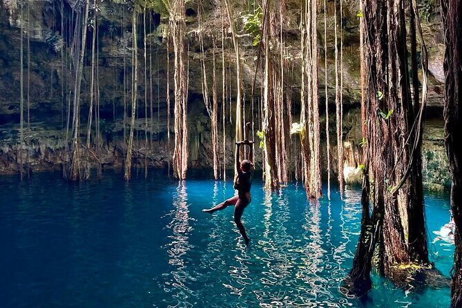 Private Tour 3 Cenotes & Valladolid Suytun Oxman Saamal Lunch - Stop 3: Hacienda Oxman Cenote with limestone, vegetation, and fish