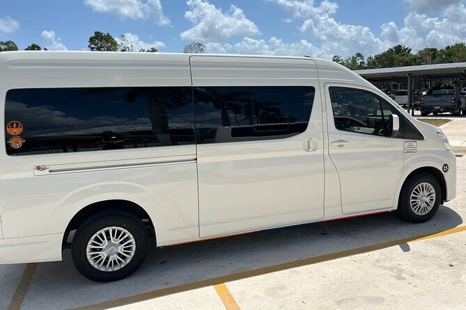 Private transfer from Tulum Airport to Tulum - Pickup at Tulum International Airport: Gate 4 and a Custom Sign